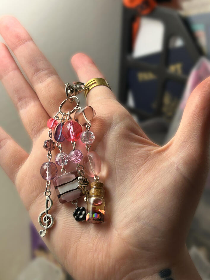 Layered glass keychain with custom glitter shaker jar charm. Layered glass keychain with custom glitter shaker jar charm.